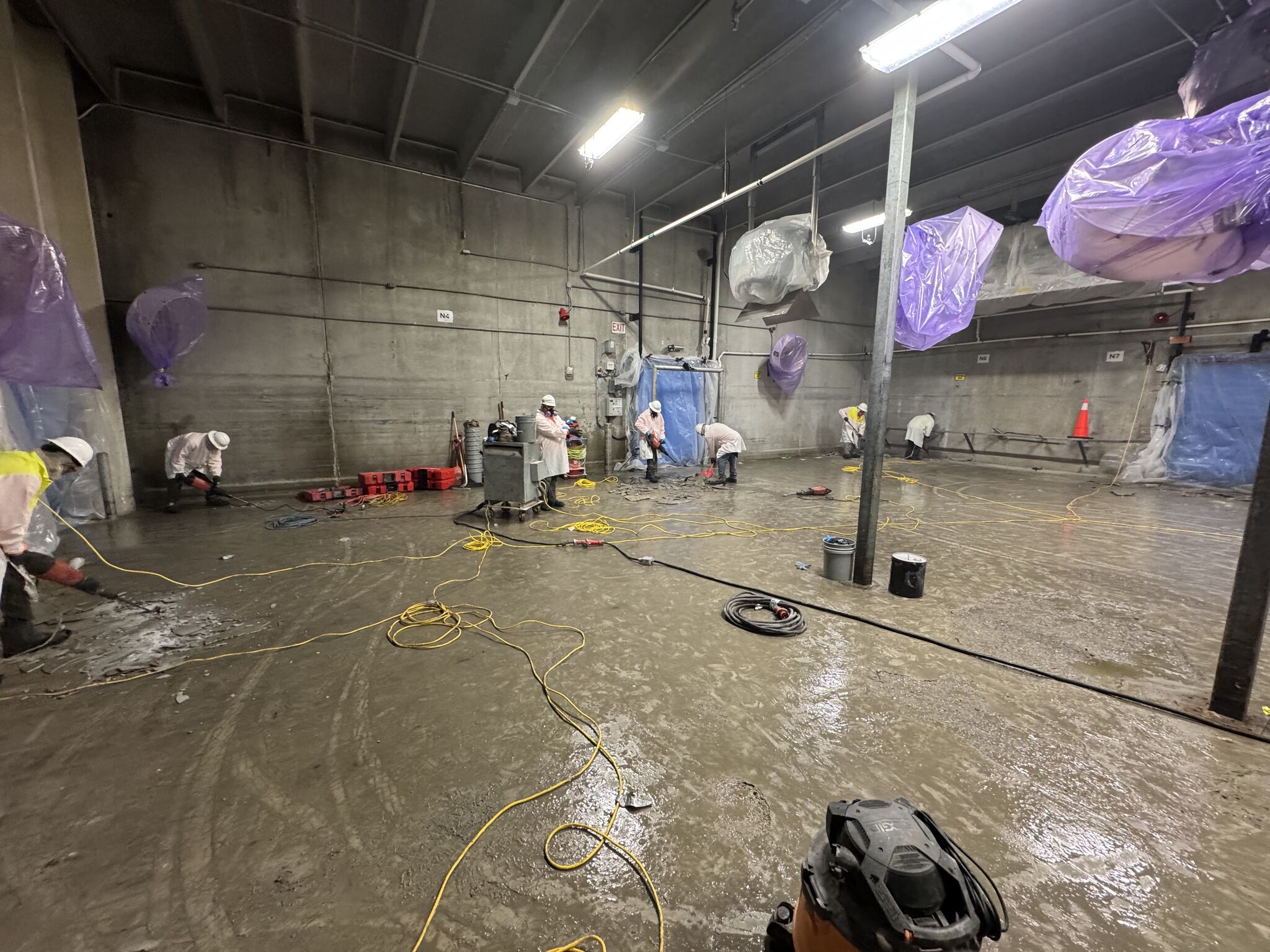 Wet SaniCrete STX floor installation progressing through a blast freezer