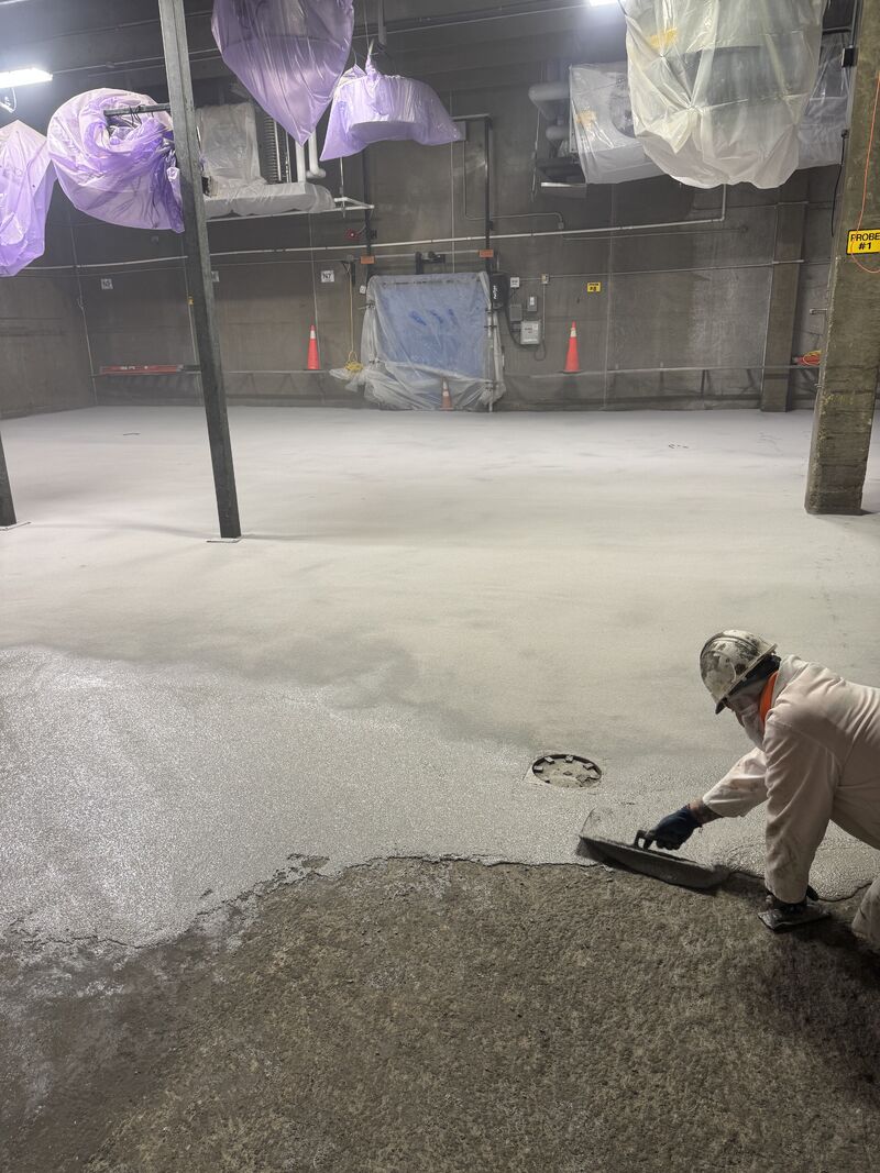 Crew member applying SaniCrete STX during blast freezer shutdown work