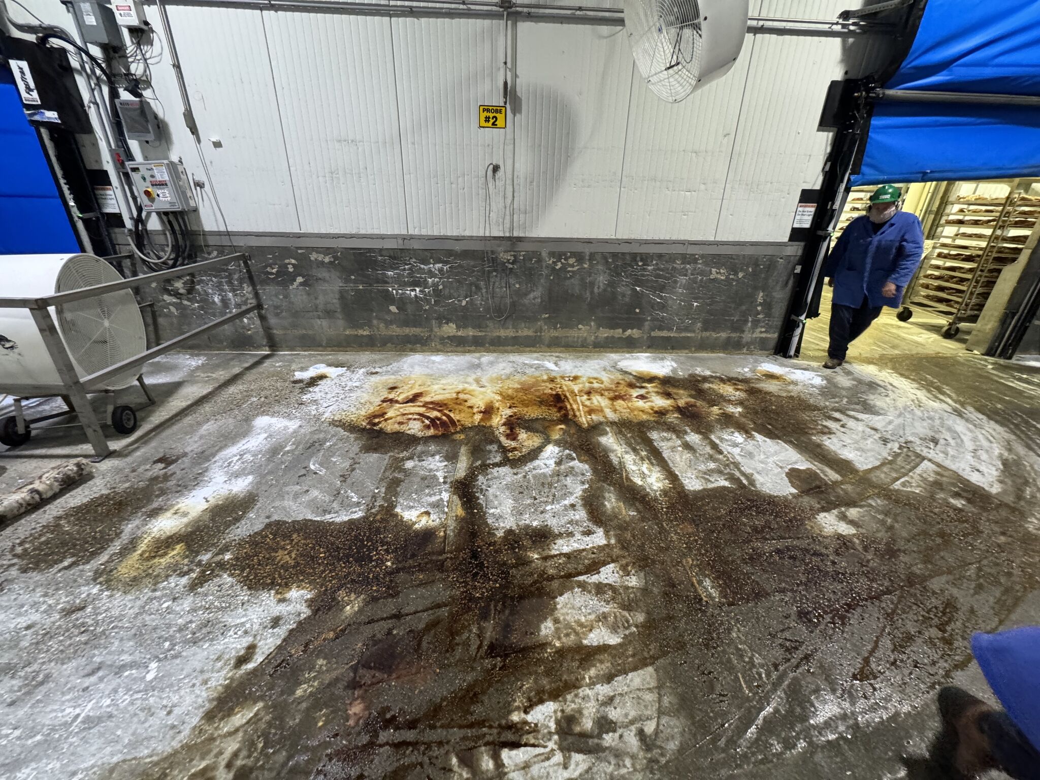 Damaged blast freezer slab area before repair and resurfacing