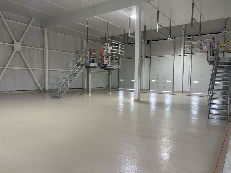 SaniCrete STX dairy receiving bay floor with custom tall radius cove base