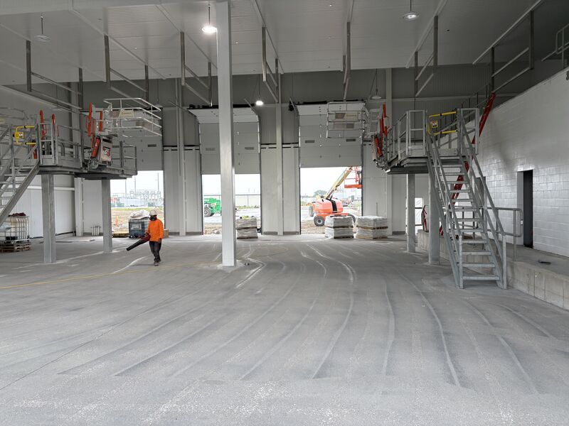 Finished SaniCrete STX floor and tall cove base in a dairy receiving bay