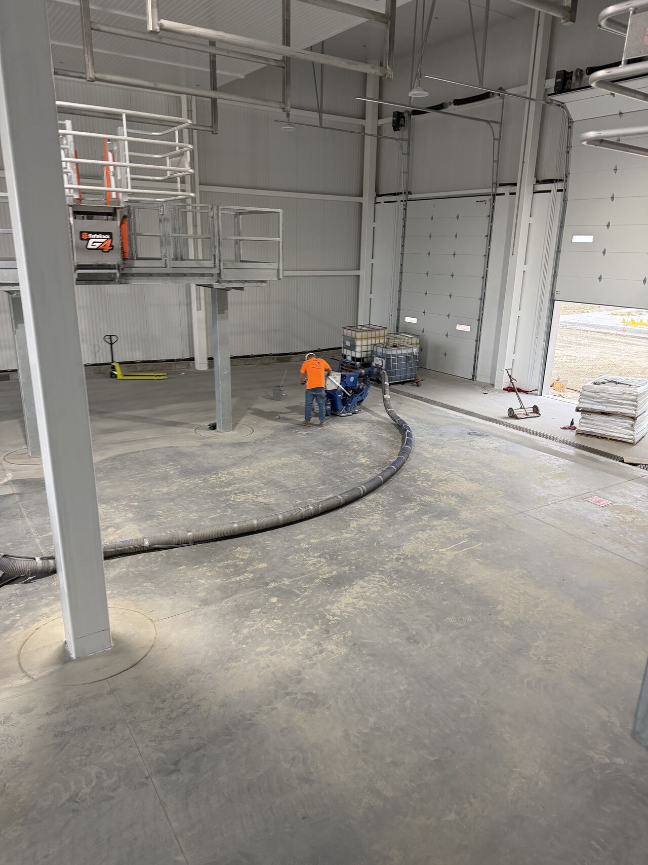 Prepared dairy receiving bay slab before SaniCrete STX installation