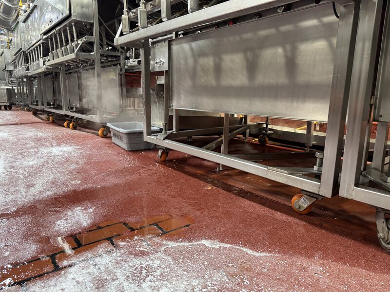 Food processing floor repair area after failed dairy brick removal