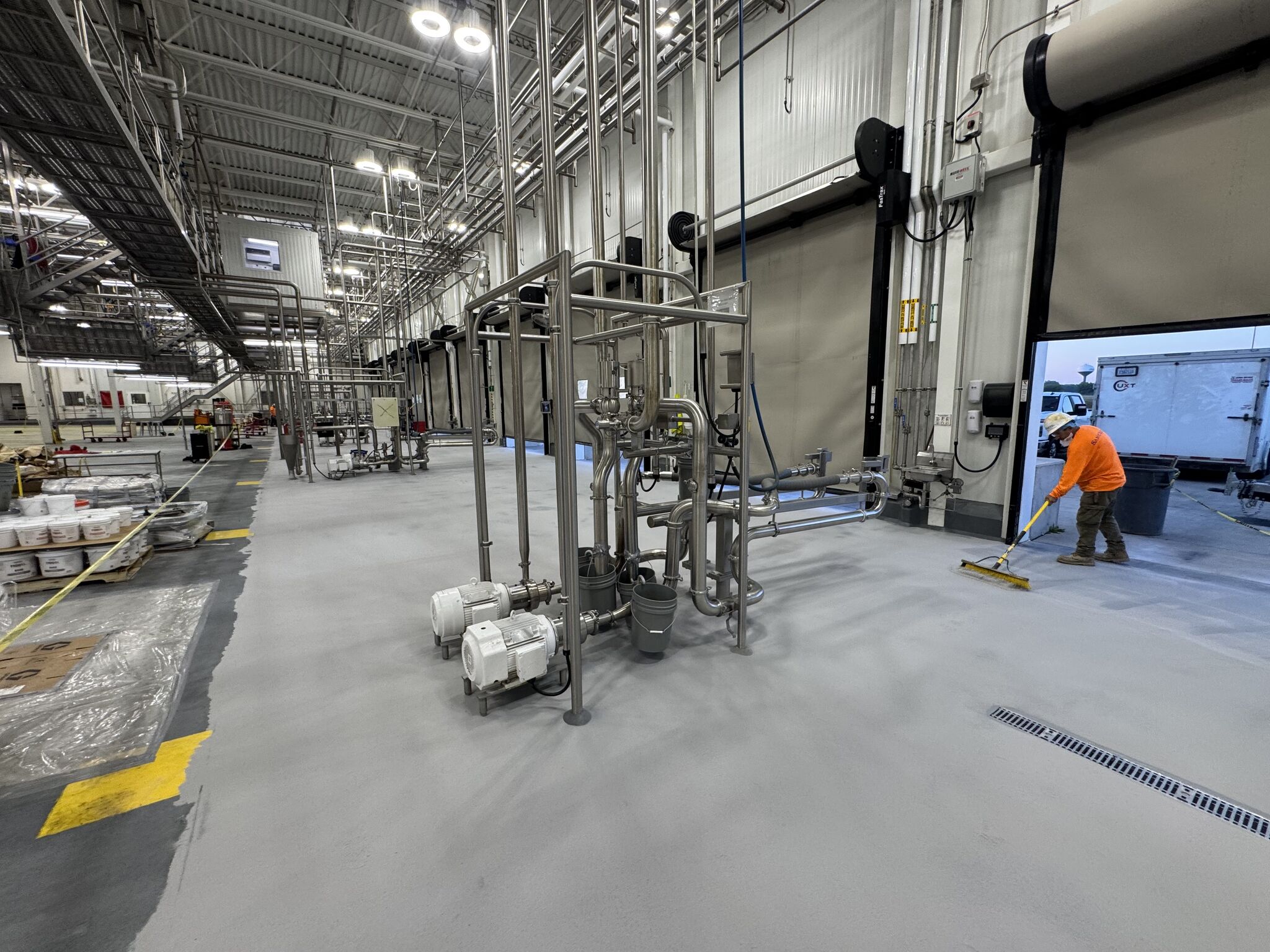 Finished SaniQuartz dairy production floor around process piping