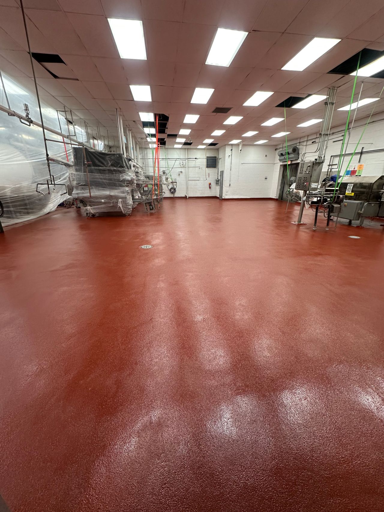 Completed red SaniCrete SL floor at dairy processing facility