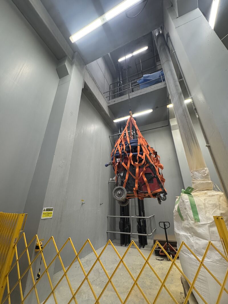 SaniCrete STX urethane cement flooring installed on elevated floor with chain fall hoist access