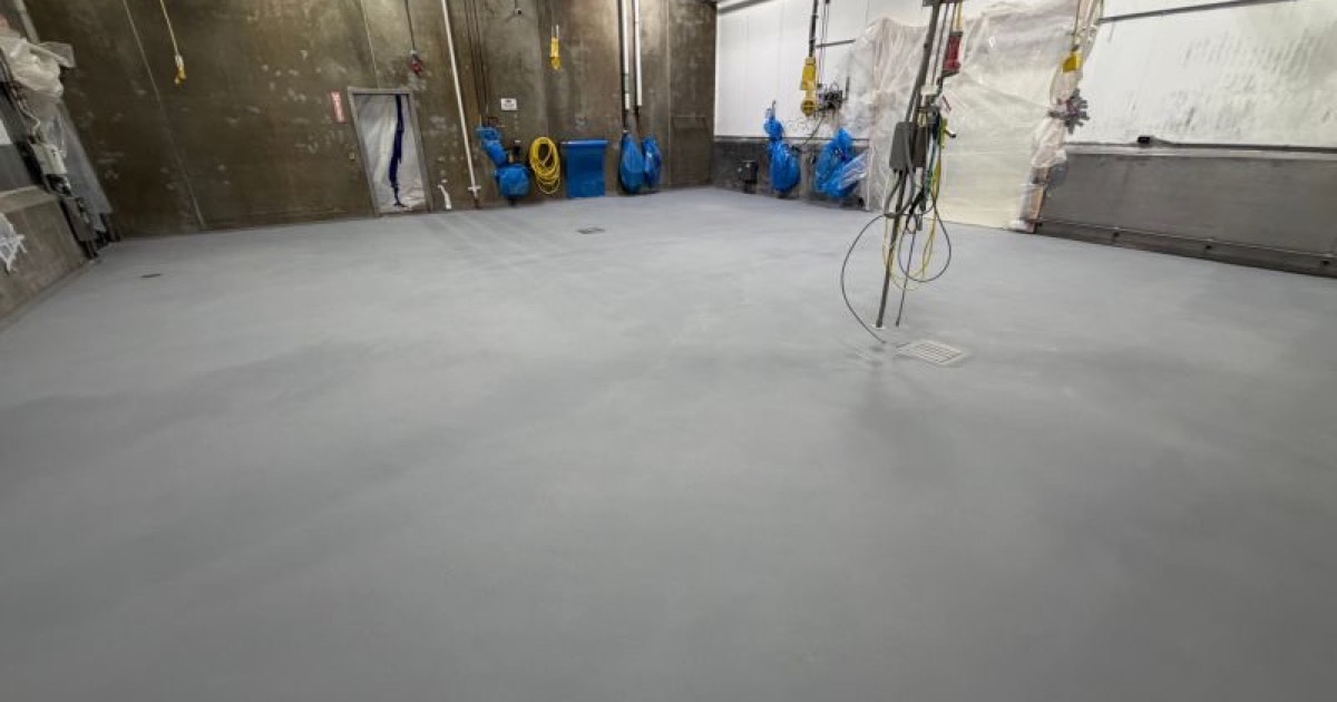 Finished seamless gray SaniCrete STX floor before production equipment installation