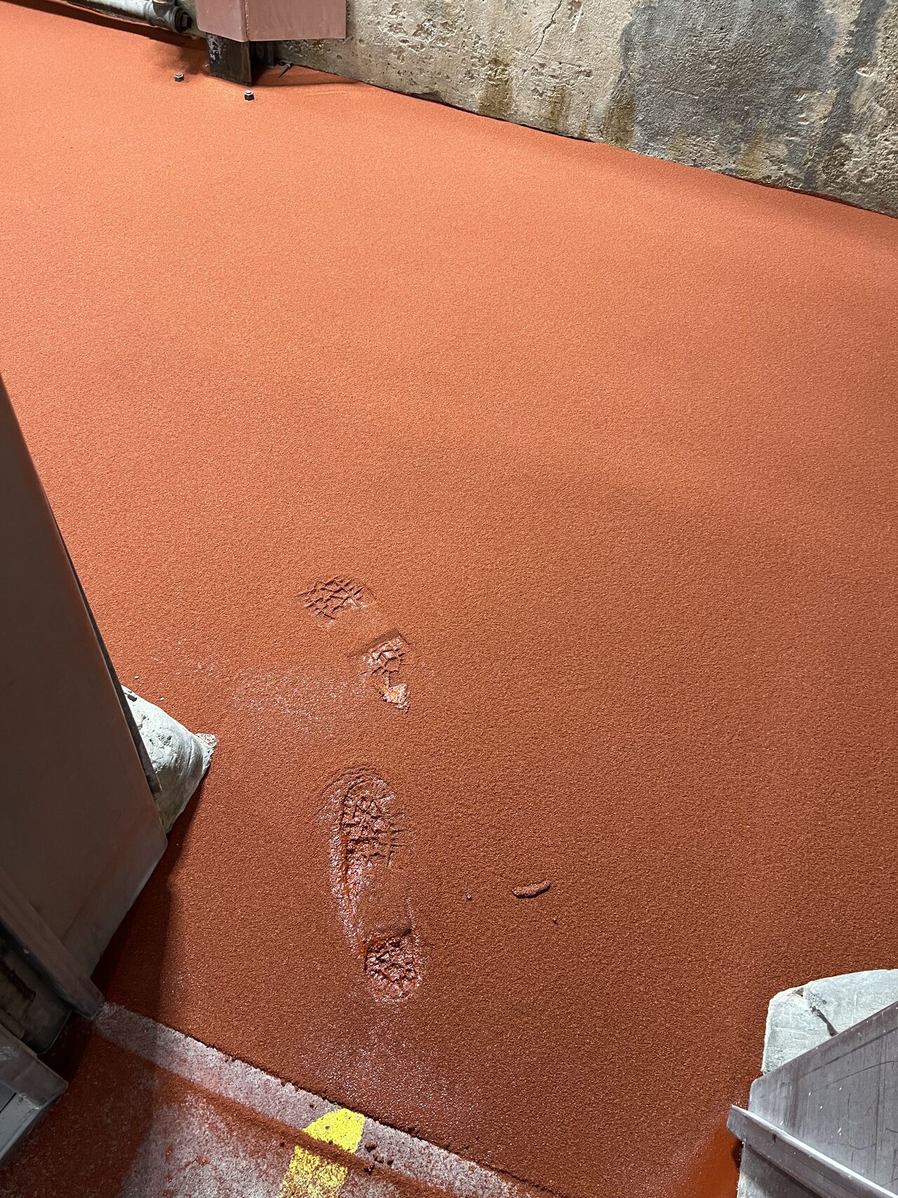 Boot prints in freshly laid flooring