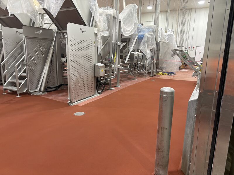 Finished SaniCrete STX floor installed after removing hidden delamination in a food plant