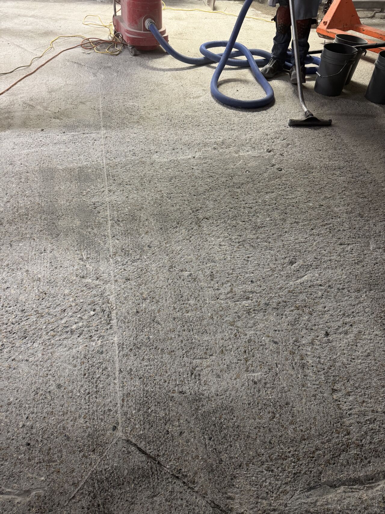 Concrete substrate after scarification with all old coatings removed, ready for new flooring system