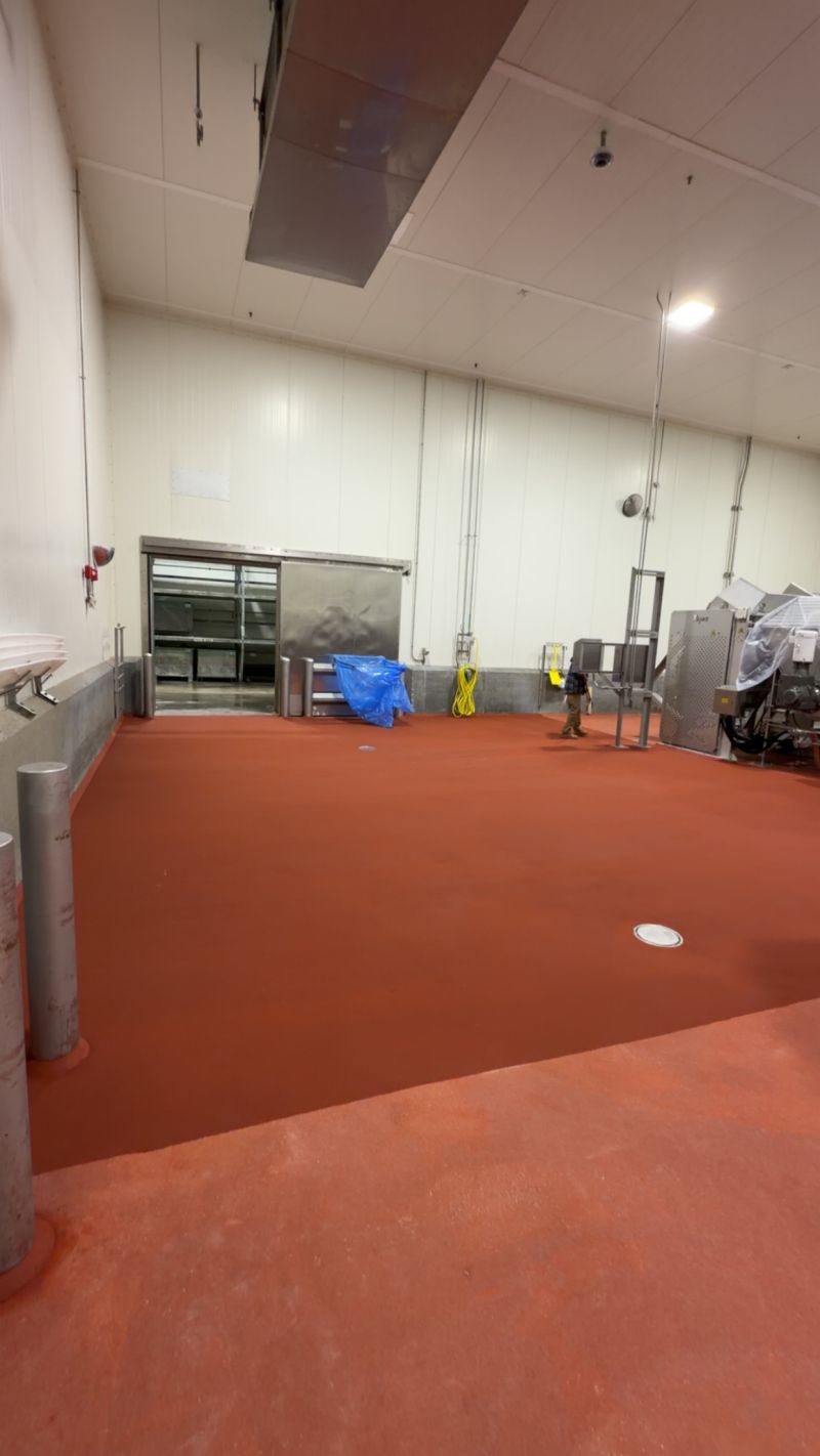 SaniCrete crew wearing One Throat to Choke gear during food plant floor work