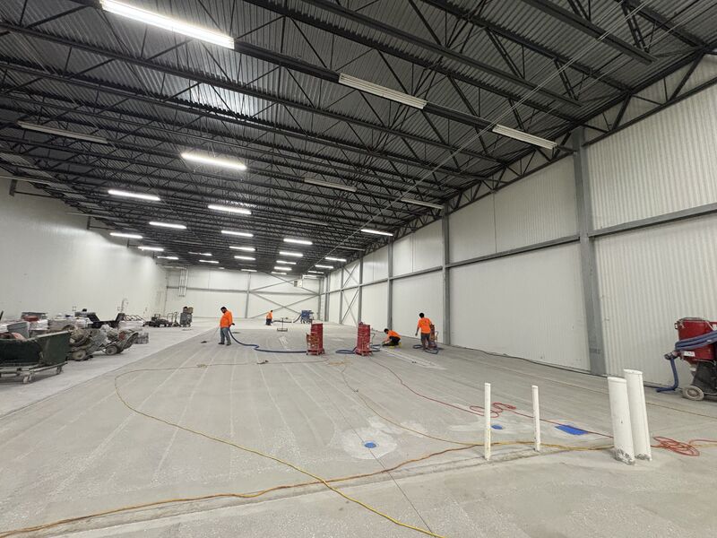 Large finished gray SaniCrete STX floor in a new production area