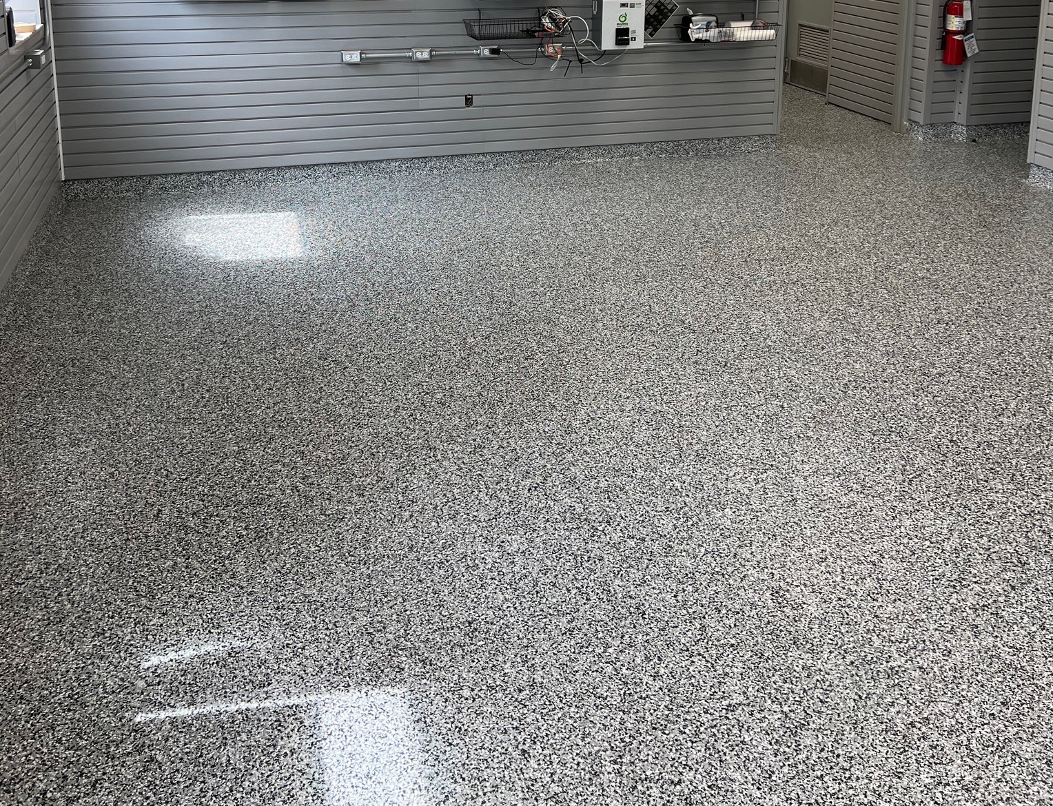 SaniFlake decorative flake flooring with gray and black vinyl chips