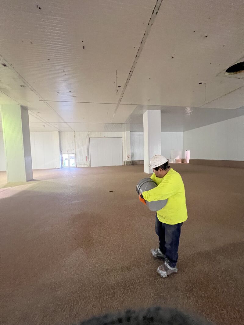 SaniFlake resinous floor in a food plant locker room, breakroom, or cafeteria support space