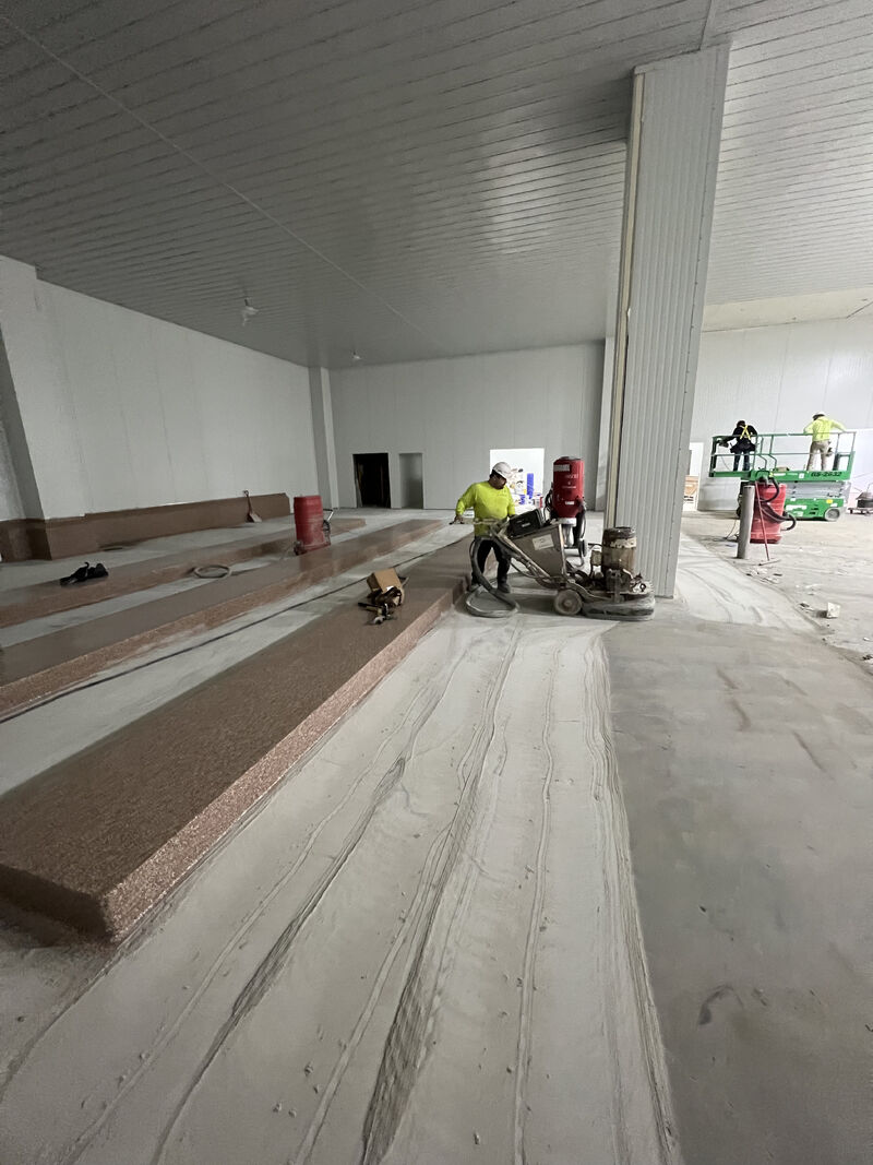 SaniFlake epoxy flake floor installed in a food plant support area