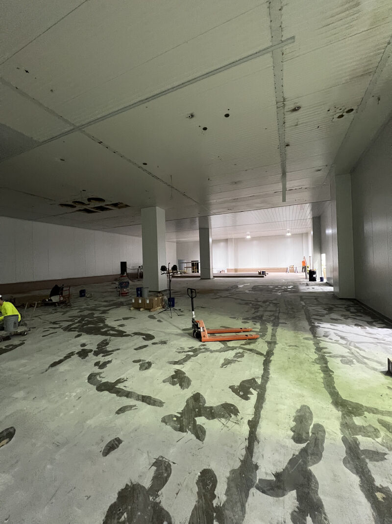 Close view of seamless SaniFlake flooring in a food plant breakroom or cafeteria area