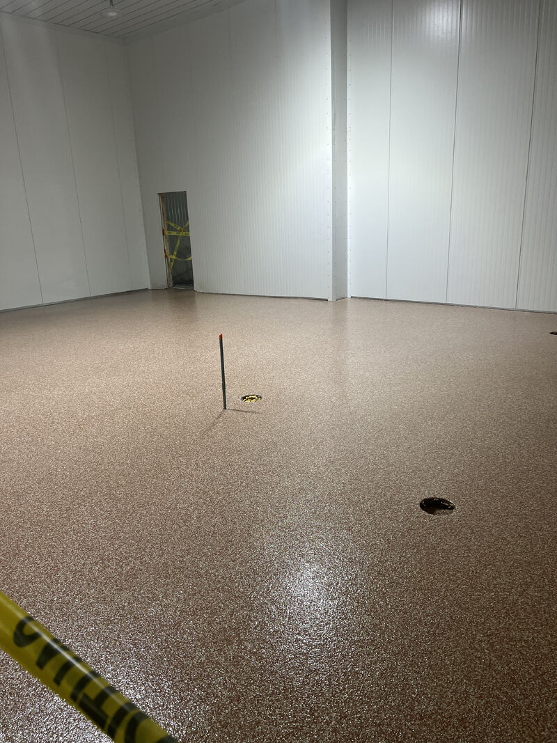 Finished SaniFlake floor in a food plant locker room, breakroom, or cafeteria area
