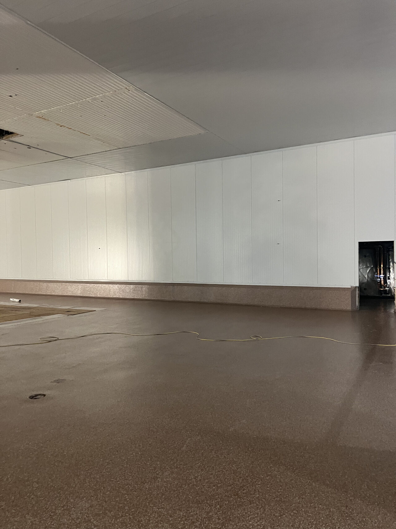 Finished SaniFlake floor across a clean food plant support room