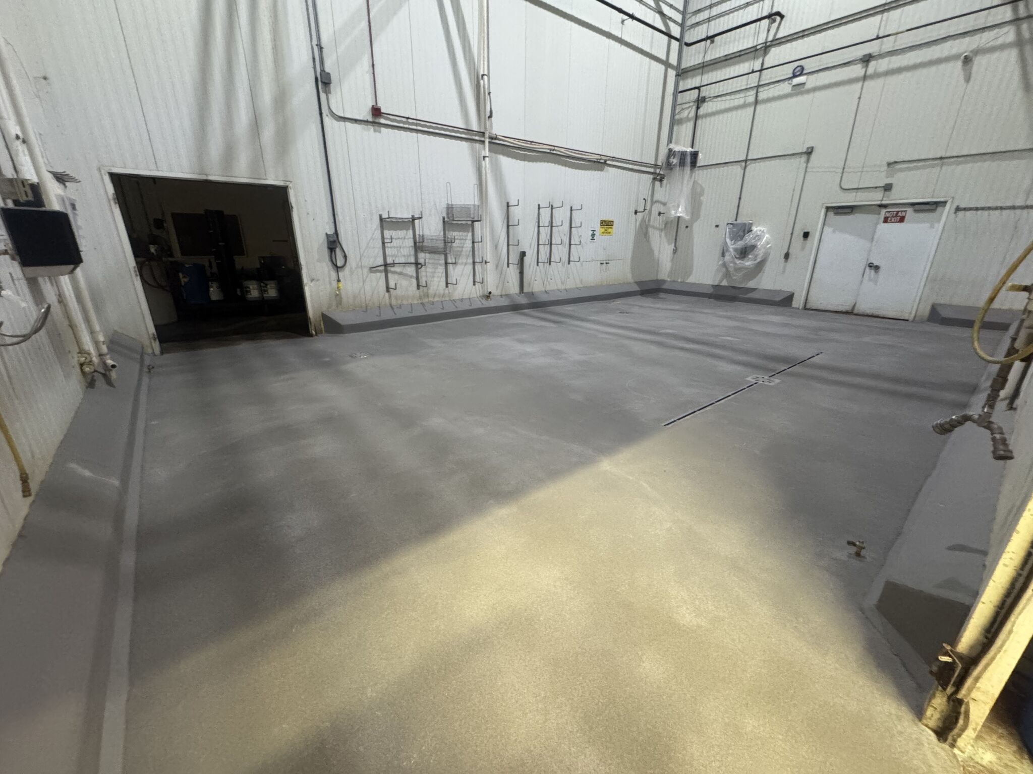 Chemical room after SaniCrete STX installation — textured cementitious urethane with VR curbing