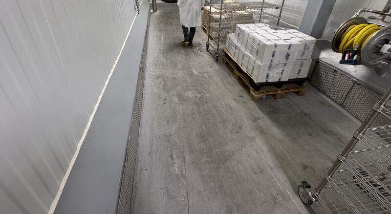 Cheese plant SaniCrete floor with equipment and washdown wear