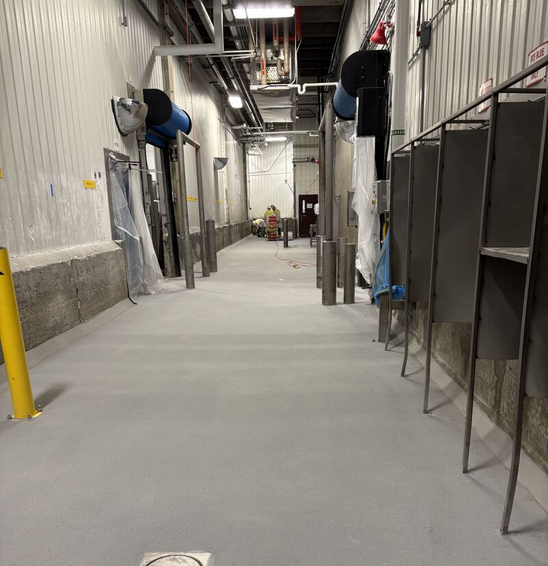 Finished SaniCrete STX floor in a food processing production corridor